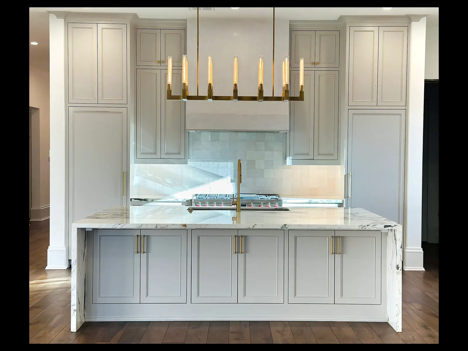 Kitchen with painted white cabinets and island